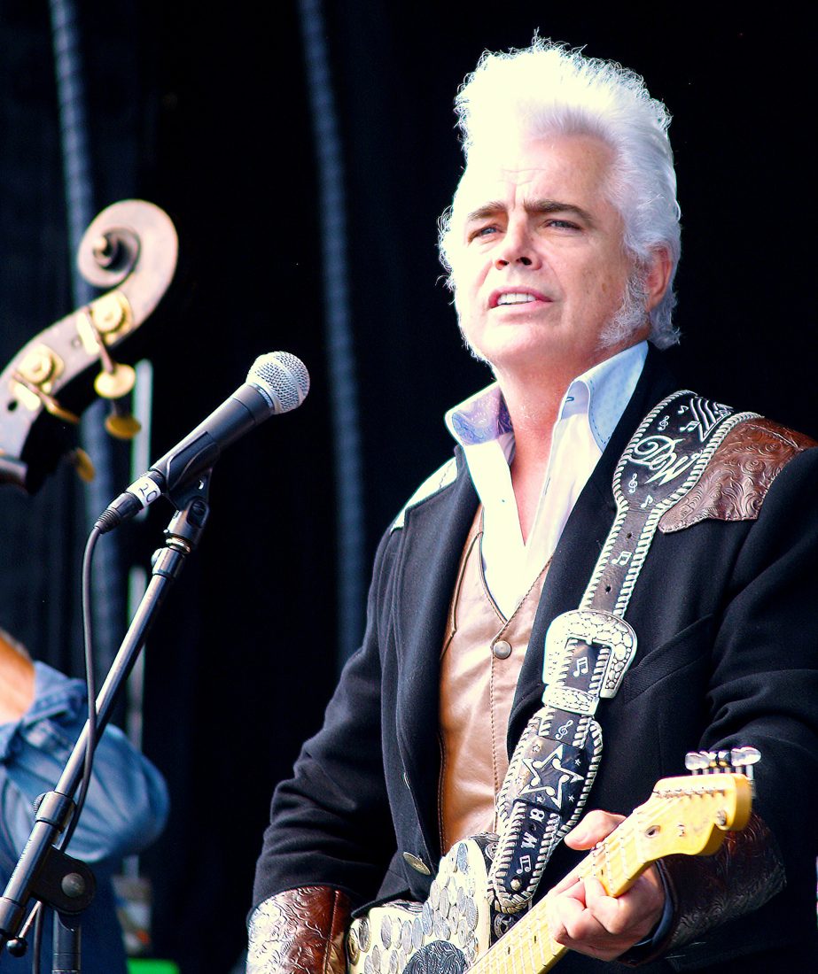 Singer with guitar on stage